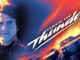 Promotional poster for the movie 'Days of Thunder' featuring a left-side portrait of a man in a racing uniform against a blue-orange fiery backdrop and diagonal title text.