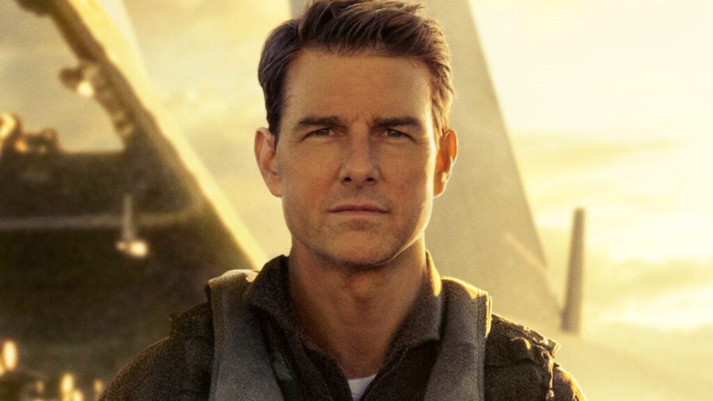 image | GotchaMovies Man with short dark hair and backpack stands in warm sunset light, looking serious.