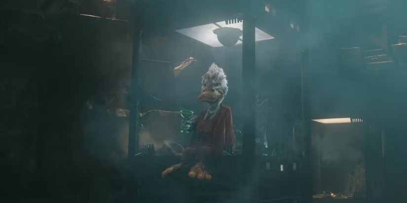 Bird-headed humanoid in red robes sits in a smoky industrial room, holding a green goblet.