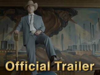 Man in a light gray suit and cowboy hat stands with a cane in front of an industrial factory mural, overlaid with 'Official Trailer' text.
