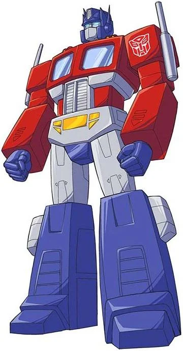 image | GotchaMovies Optimus Prime, the red-and-blue Transformer, standing with fists at his sides in a power pose.