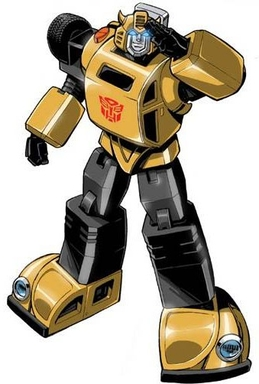 image | GotchaMovies Gold and black Transformer robot in a dynamic pose with the Autobot emblem on its chest.